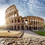 Colosseum in Rome and morning sun, Italy